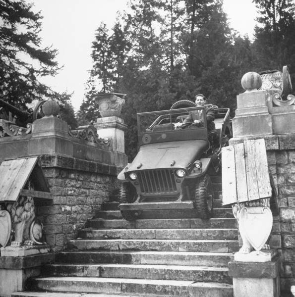 King Michael of Rumania driving down steps leading out of Sinaia palace1