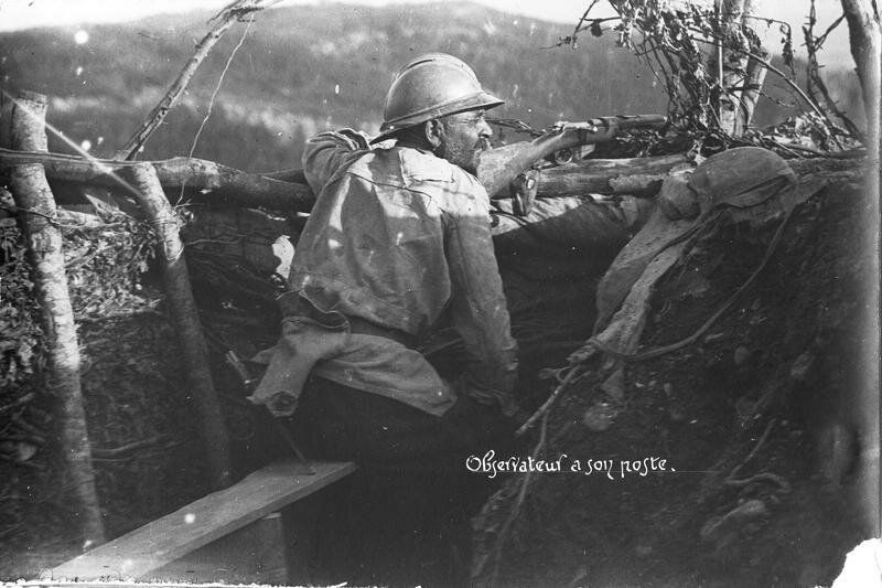 Observer's position in a trench, his gun resting on the parapet