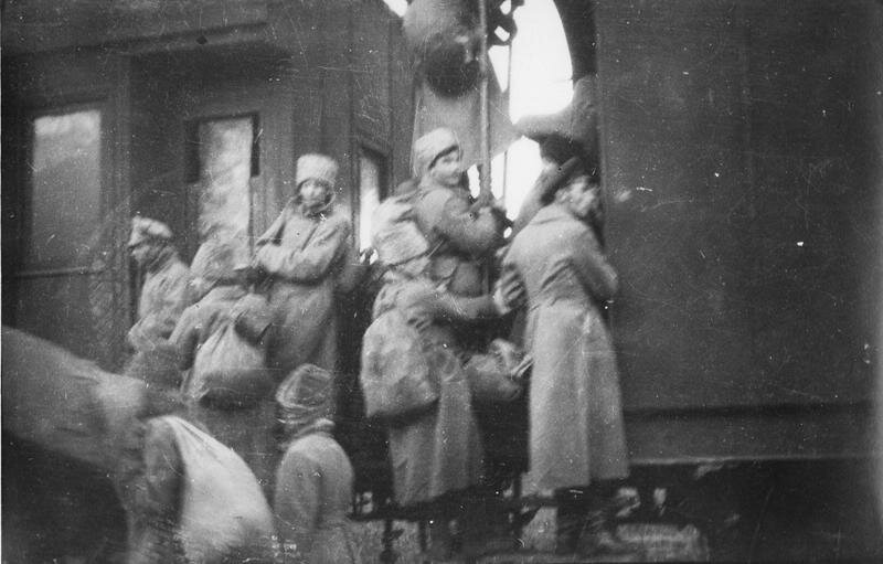 Russian soldiers returning to their homes carrying bags in the fruits of their rapine