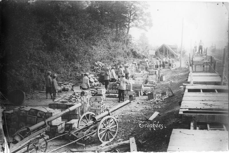 Trophies taken from the enemy equipment and ammunition lined up near a railway